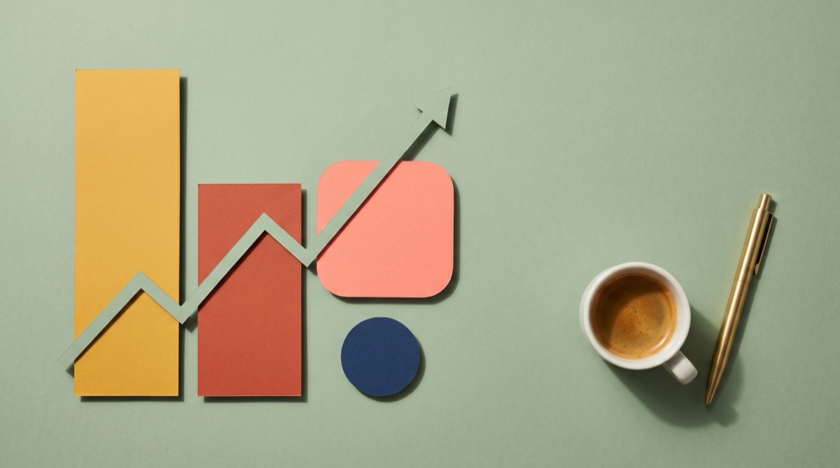 Editorial paper-craft bar chart in mustard, terracotta, and coral with a sage trend arrow rising across them, beside an espresso and brass pen on a sage-green seamless backdrop