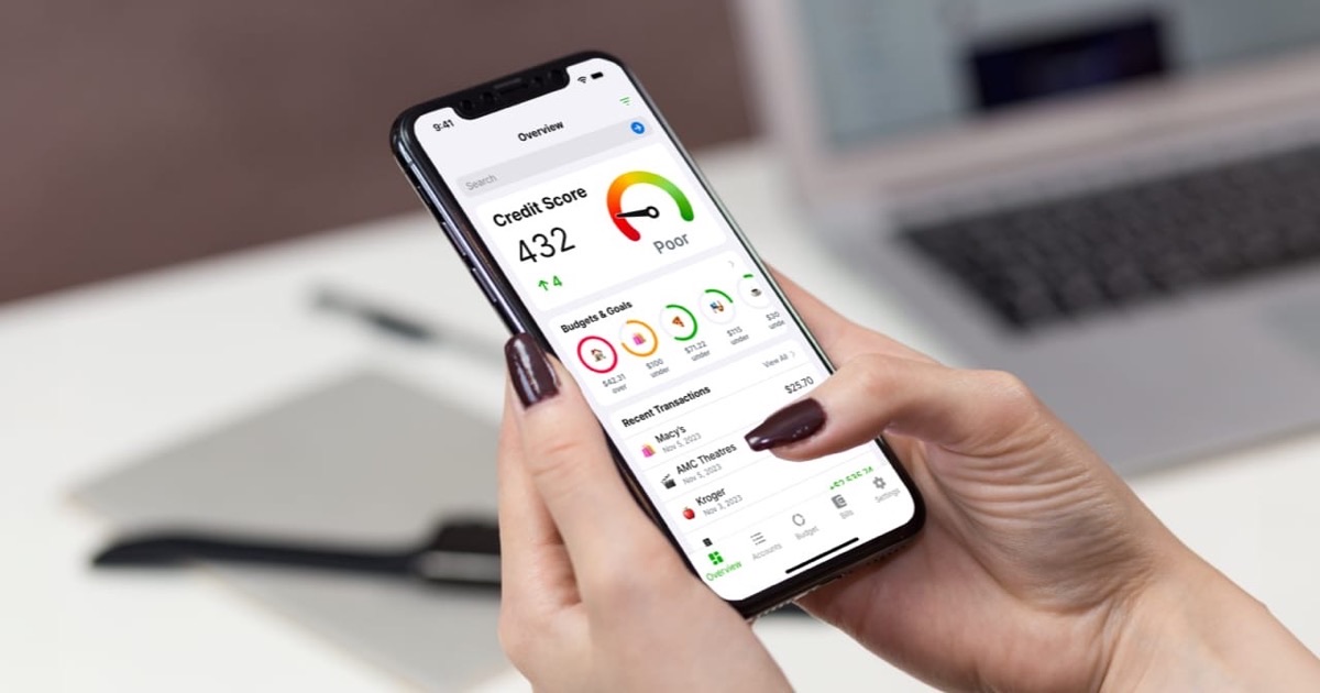 Person writing a credit improvement plan in a notebook at a bright modern desk