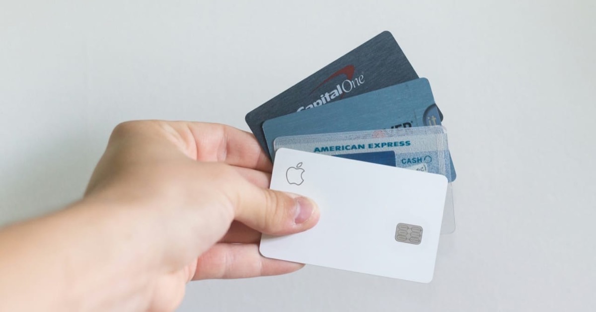 Runner's sneakers crouched at a red track starting line, low angle shot with kinetic energy