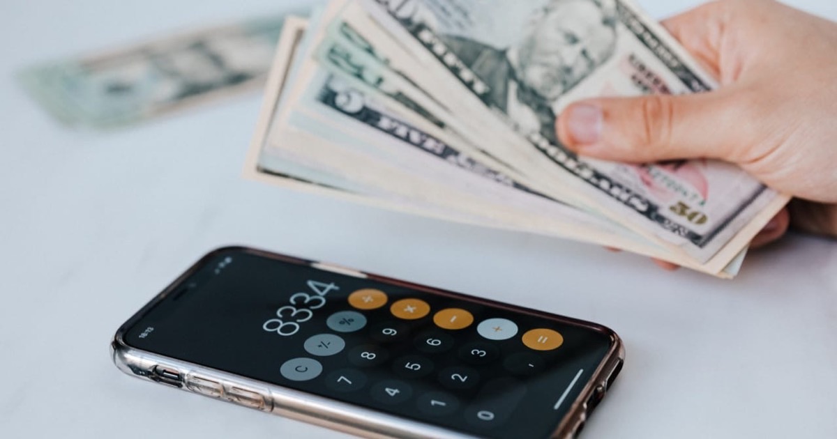 Organized quarterly tax documents and a marked calendar on a clean office desk